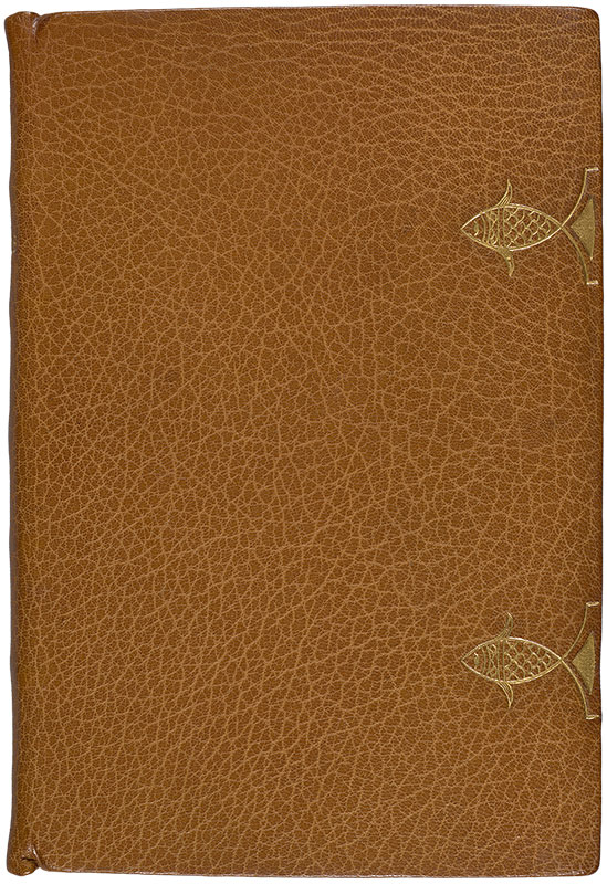 A closed book with a light brown full morroco leather binding and two golden fish tooled onto the right side of the cover simulating clasps. Only the front cover is visible.