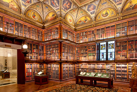 Photo of East Room of J. Pierpont Morgan's Library looking towards north west corner showing painted ceiling lunettes, display cases and doorway to Rotunda.