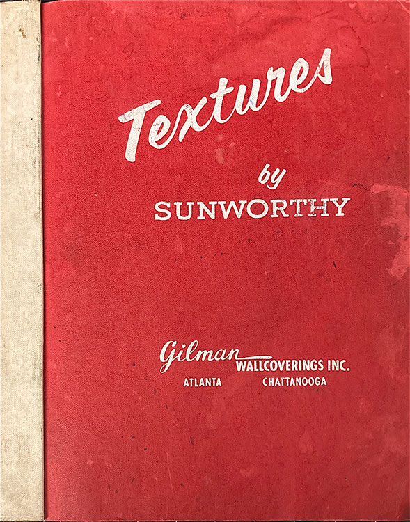 Red sketchbook cover with off-white text that says Textures by Sunworthy Gilamn wallcoerings Inc. Atlanta Chatanooga.