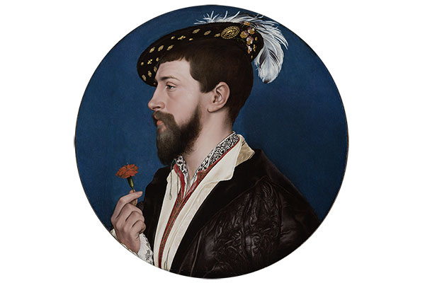 Roundel portrait of bearded man in profile holding a flower wearing feathered cap.