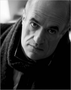 Blakc and white photo of Colm Toibin looking straight at camera.