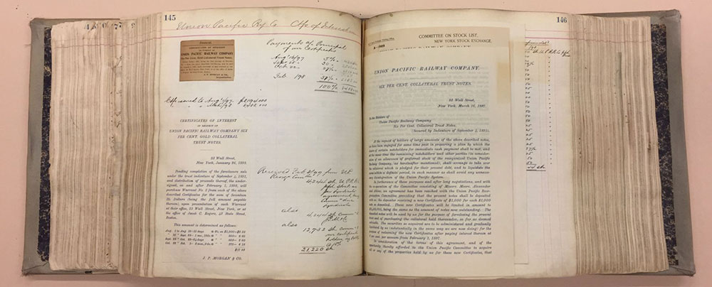 Open page spread of thick ledger volume showing text and numbers.