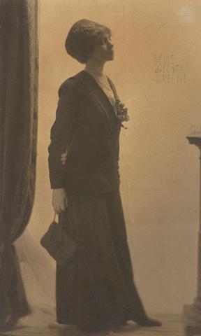 Belle da Costa Greene standing looking right in full figure profile.