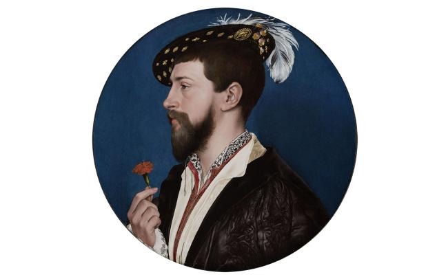 Circular portrait of bearded man holding red rose, wearing a black cap with white feather.