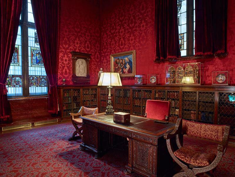 View of Pierpont Morgan's study with desk, chair, and lamp.
