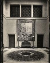 View of entrance hall with tapestry hanging on wall
